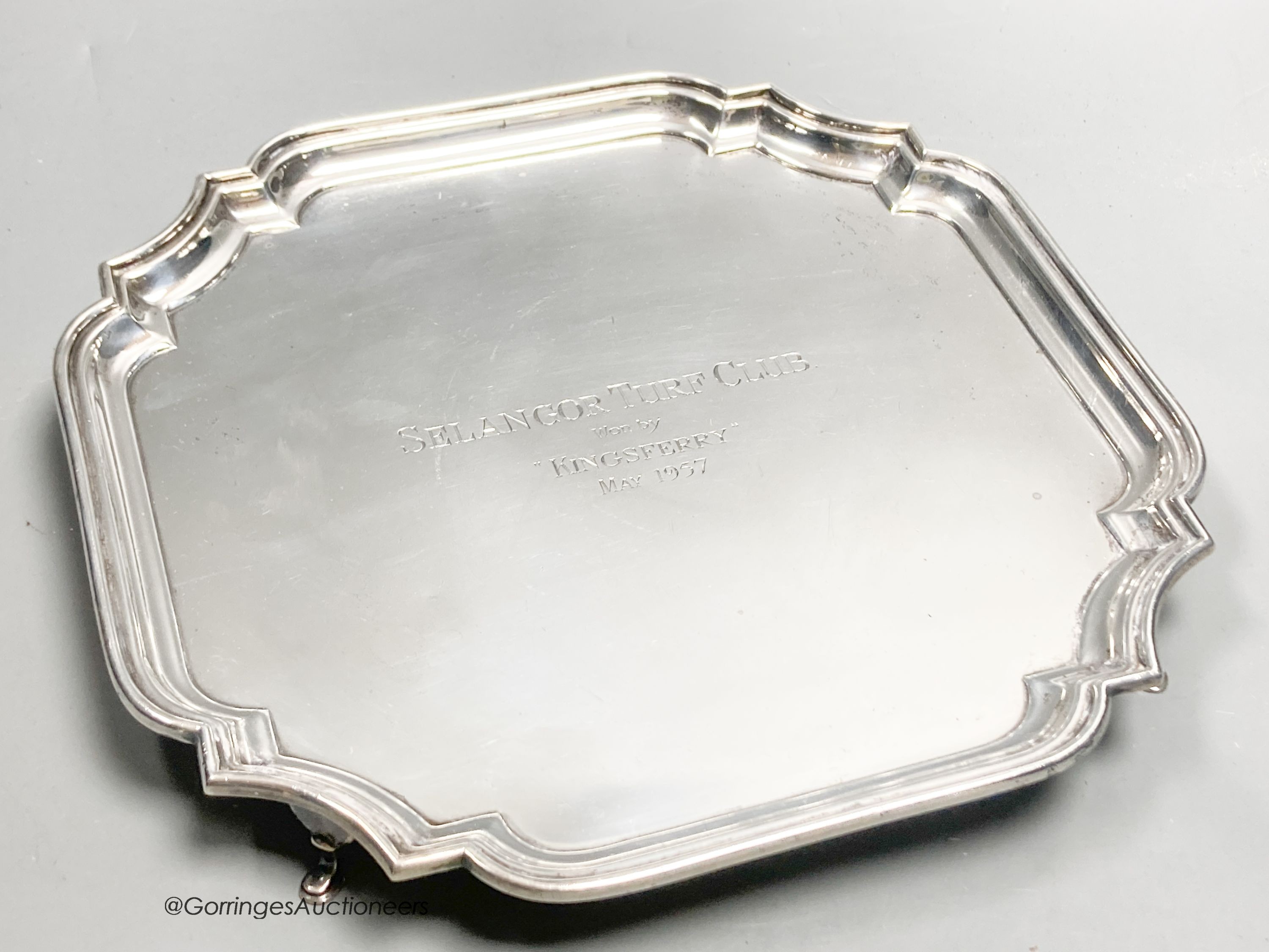 A square silver waiter with piecrust border, inscribed, Birmingham 1956, 25.9cm, with engraved inscription, 25oz.